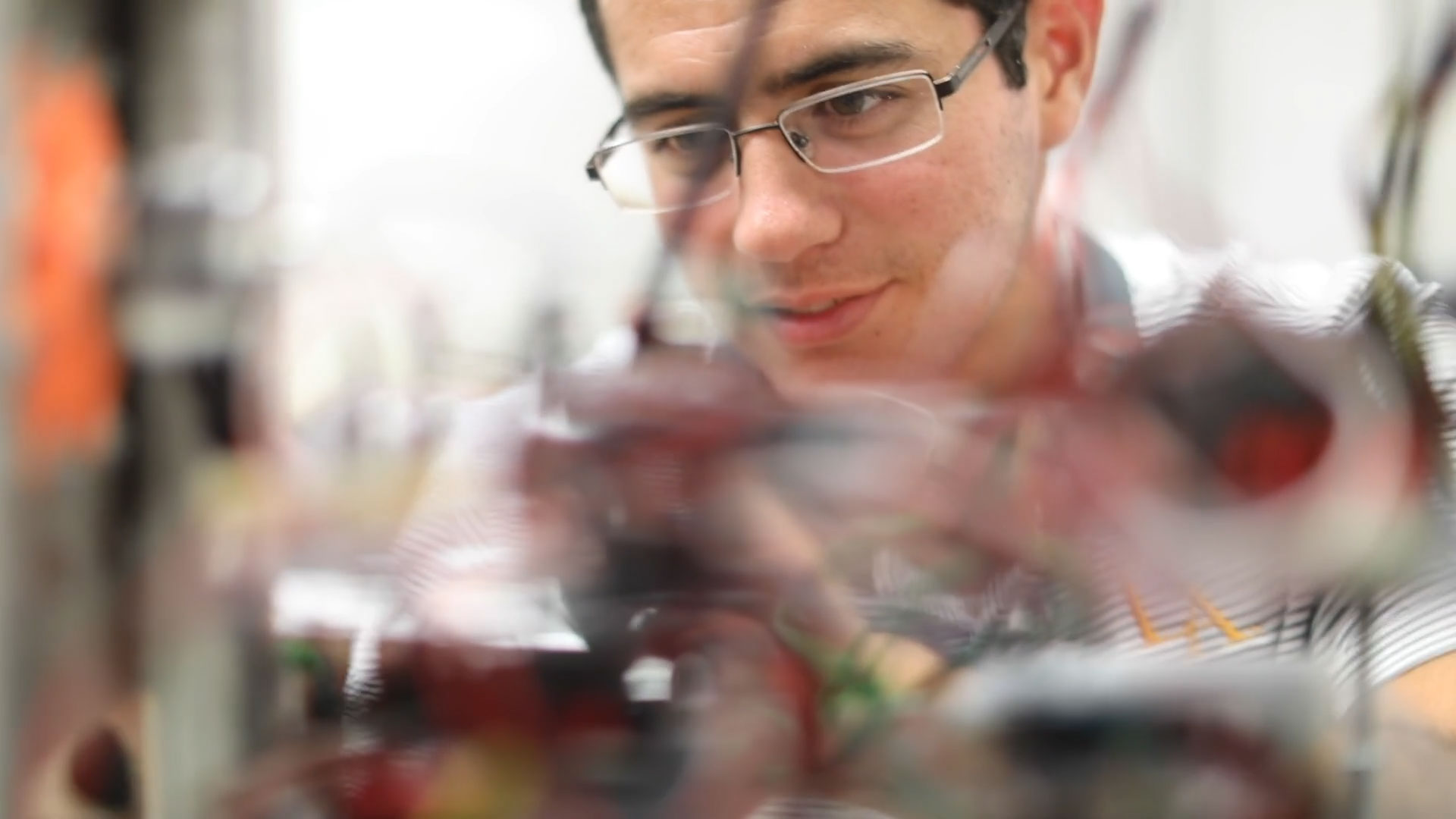 Salvador Rojas working with robotics inside the engineering labs at Cal State LA.