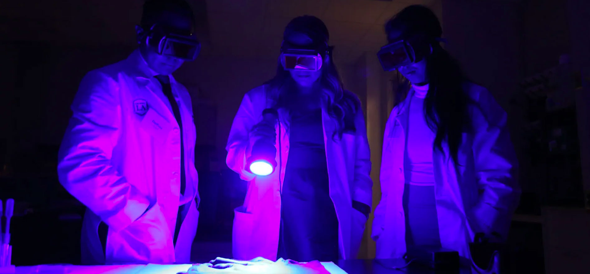 Students demonstrate Luminol tests that reveal previously hidden traces of blood.