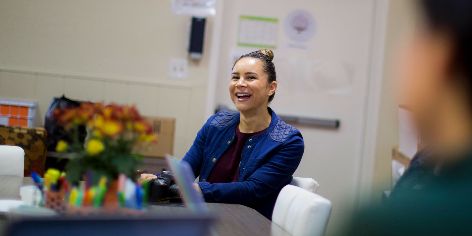 Hattie Mitchell smiling during a Crete Academy staff meeting. Hattie Mitchell smiling during a Crete Academy staff meeting.