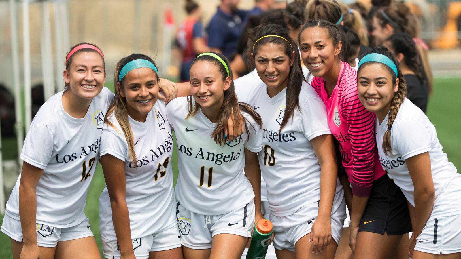 Paulina Chaidez with members of the Golden Eagles Women's Soccer team. Paulina Chaidez poses for the camera with Erika Lizarraga, Meranda Salazar, Zarette Munoz-Aguilar, Adriana Maldonado, and Valerie Mares.
