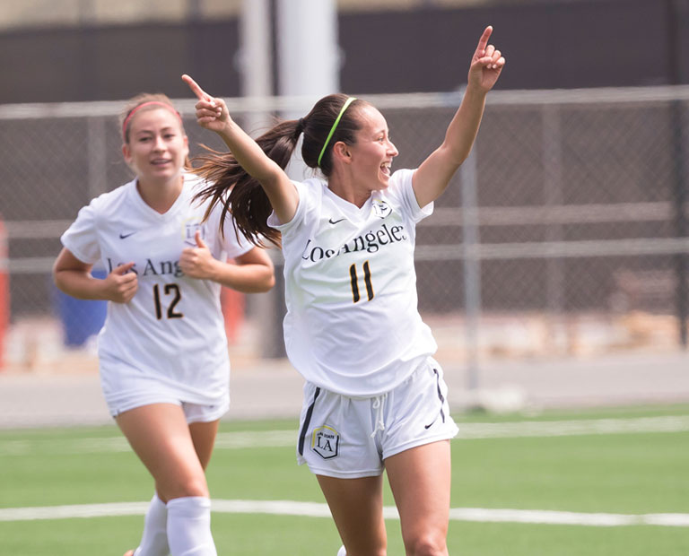 Paulina Chaidez celebrates a victory on the field with her teammates. Paulina Chaidez celebrates a victory on the field with her teammates.