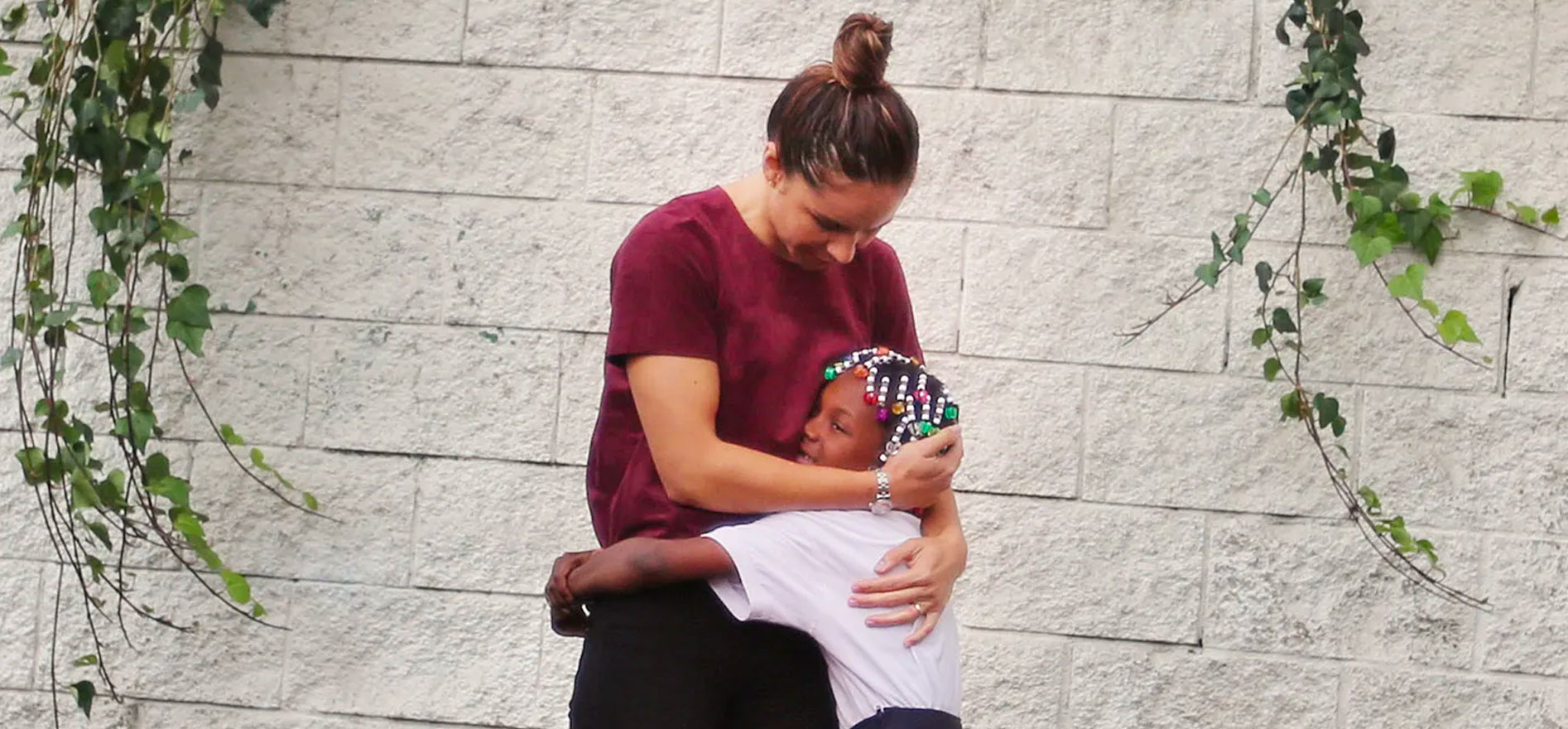 Hattie Mitchell and a Crete Academy student during recess.