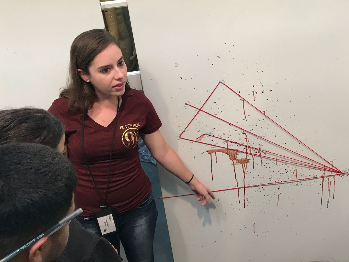 Students learn about blood spatter analysis in the Hertzberg-Davis Forensic Science Center. Students learn about blood spatter analysis in the Hertzberg-Davis Forensic Science Center.