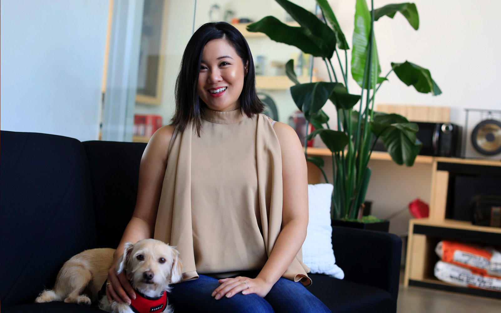 Mylen Yamamoto and her dog sitting on a couch. Mylen Yamamoto and her dog sitting on a couch.