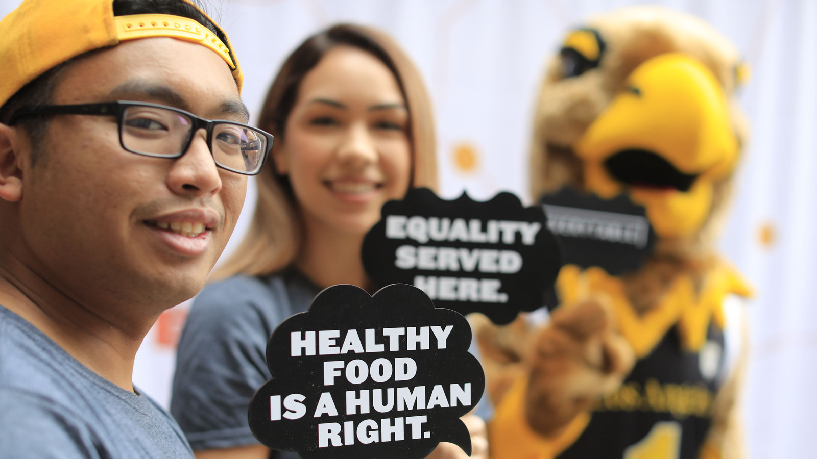 Cal State LA students with Everytable signage that reads "Healthy food is a human right".. Cal State LA students with Everytable signage that reads "Healthy food is a human right"..