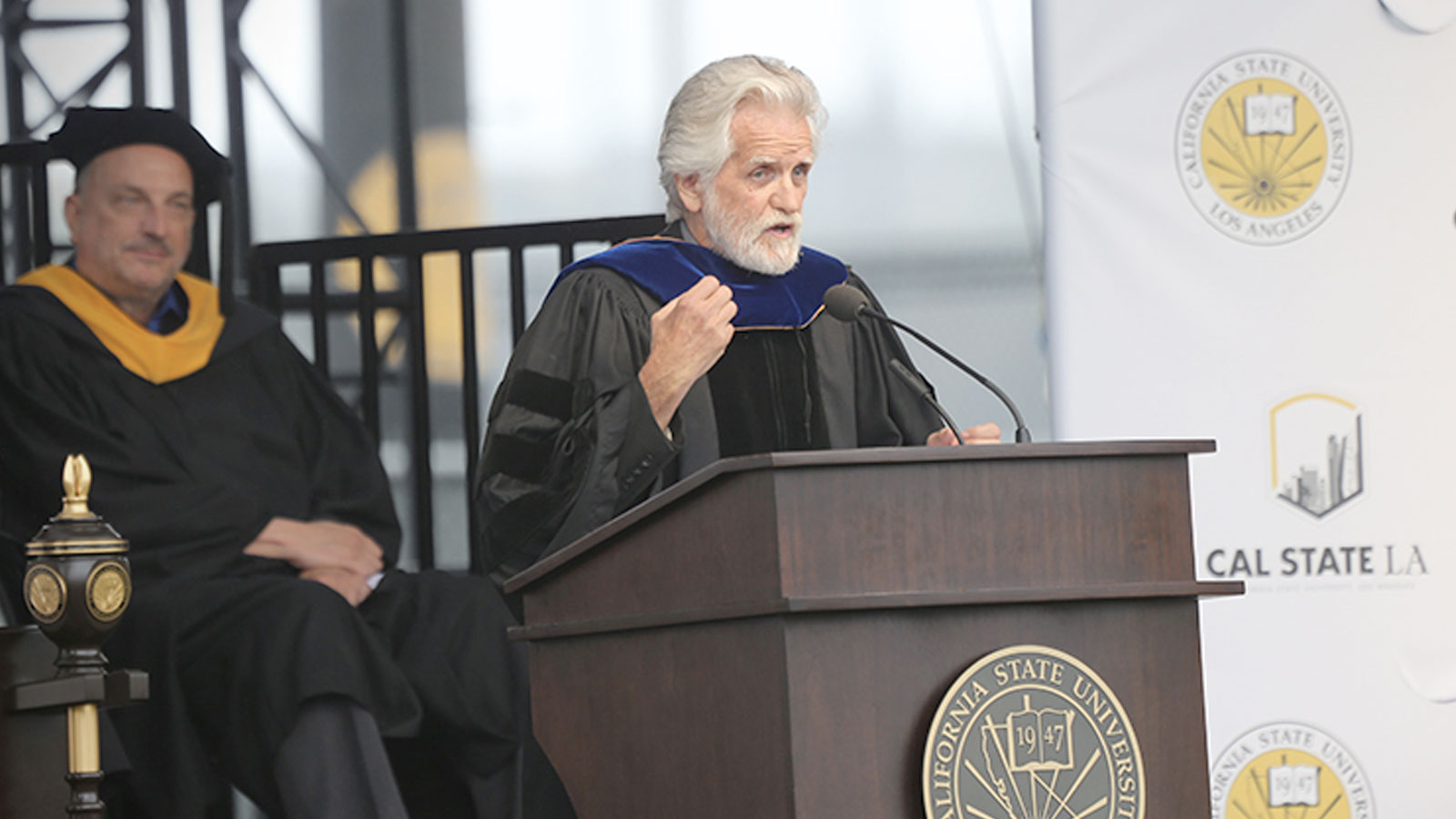 Alumni and artist, Kent Twitchell at graduation ceremony