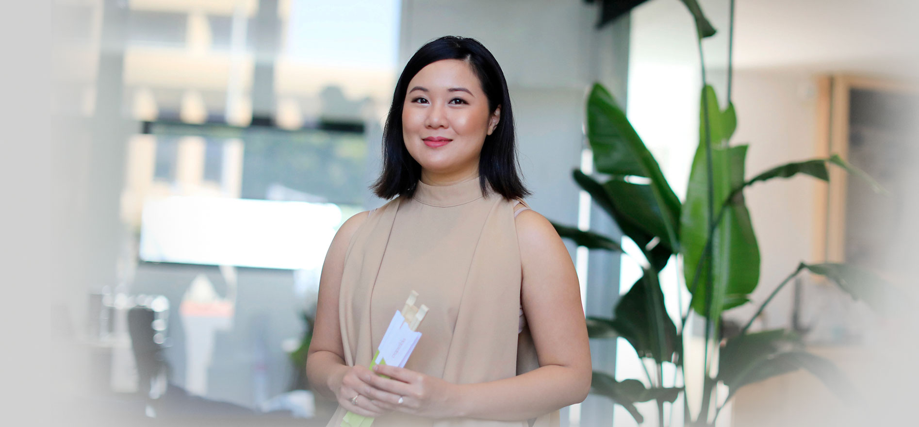 Mylen Yamamoto holding cropsticks while posing for a photo.