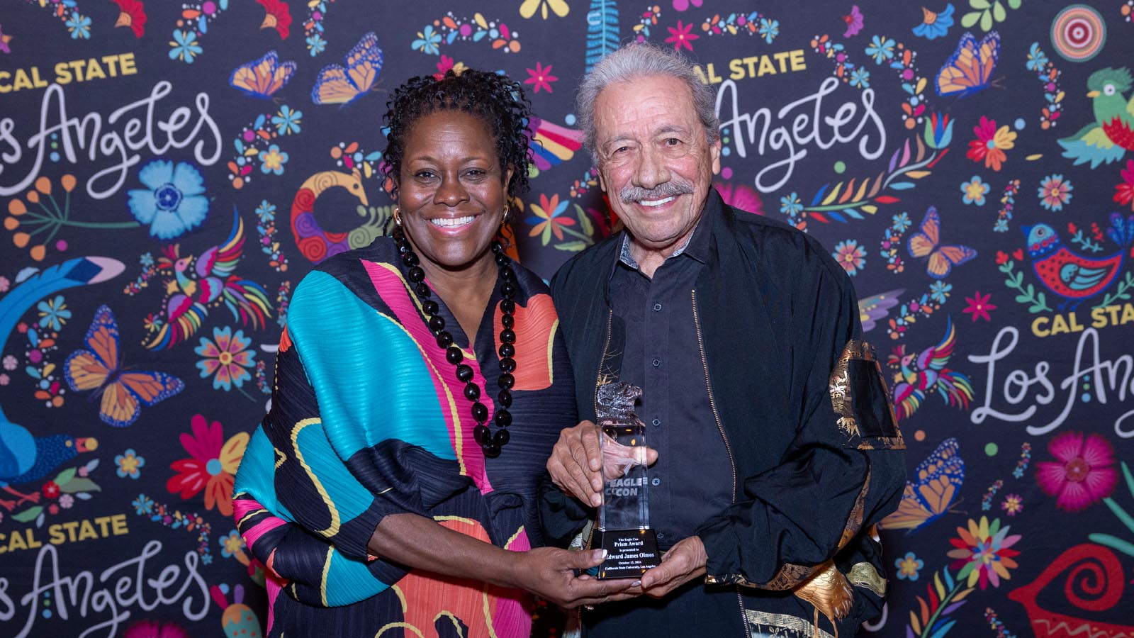 Cal State LA President Berenecea Johnson Eanes and actor Edward James Olmos smile together at the Eagle-Con Awards during Cal State LA’s Community Weekend celebration.
