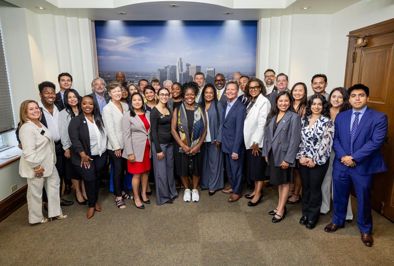 A large group of people pose for a photo together.