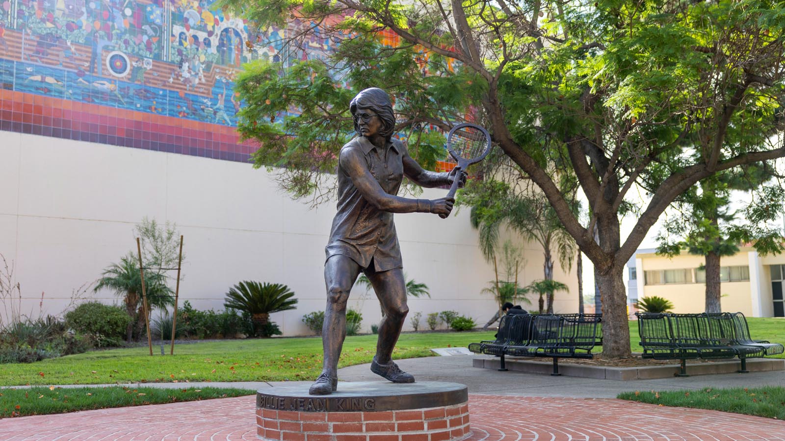 Bronze statue of tennis legend Billie Jean King on the Cal State LA campus, honoring her legacy and connection to the University.