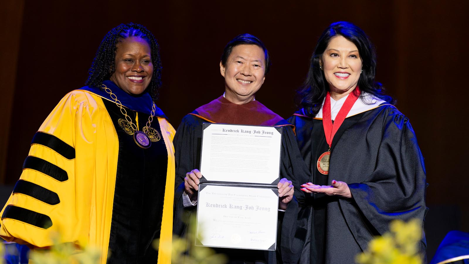 Cal State LA President Berenecea Johnson Eanes stands with Ken Jeong and Board of Trustees member Ellen Jun during the 2025 Commencement ceremony.