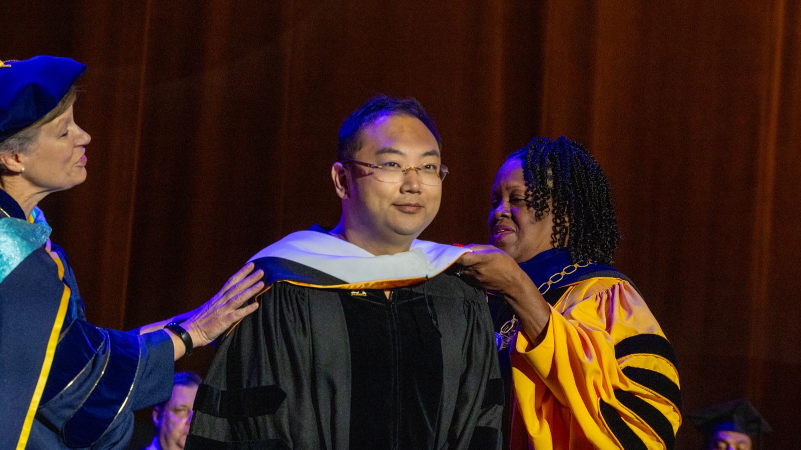 Cal State LA President Berenecea Johnson Eanes helps confer an honorary degree during the 2025 Commencement ceremony at the Shrine Auditorium.