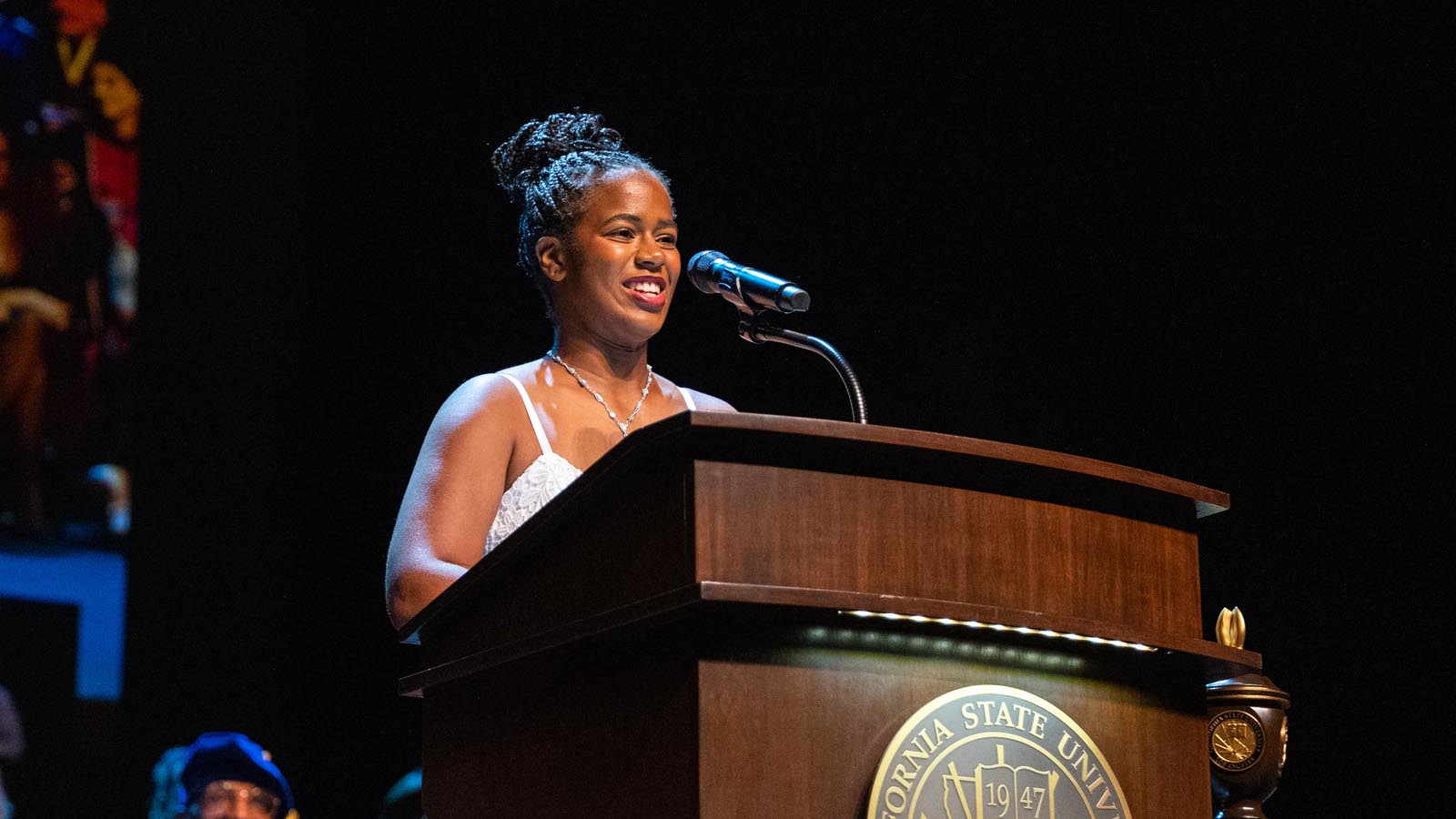 Speaker addresses the audience from the Cal State LA podium during the Investiture of President Berenecea Johnson Eanes 2025.