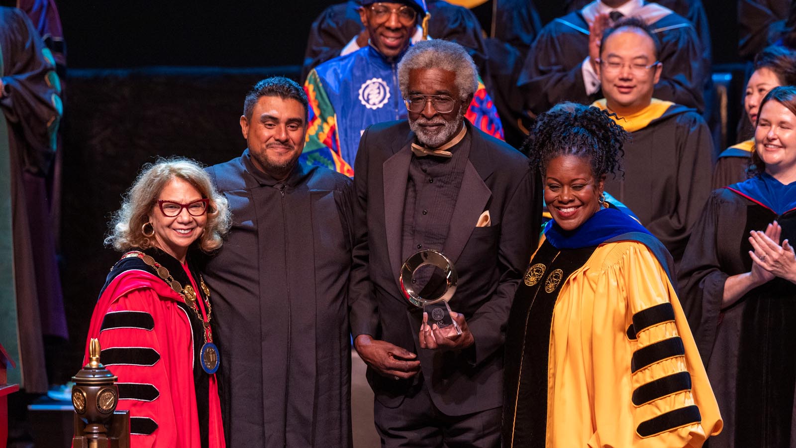 Cal State LA President Berenecea Johnson Eanes and University officials honor an award recipient during the 2025 Investiture ceremony.