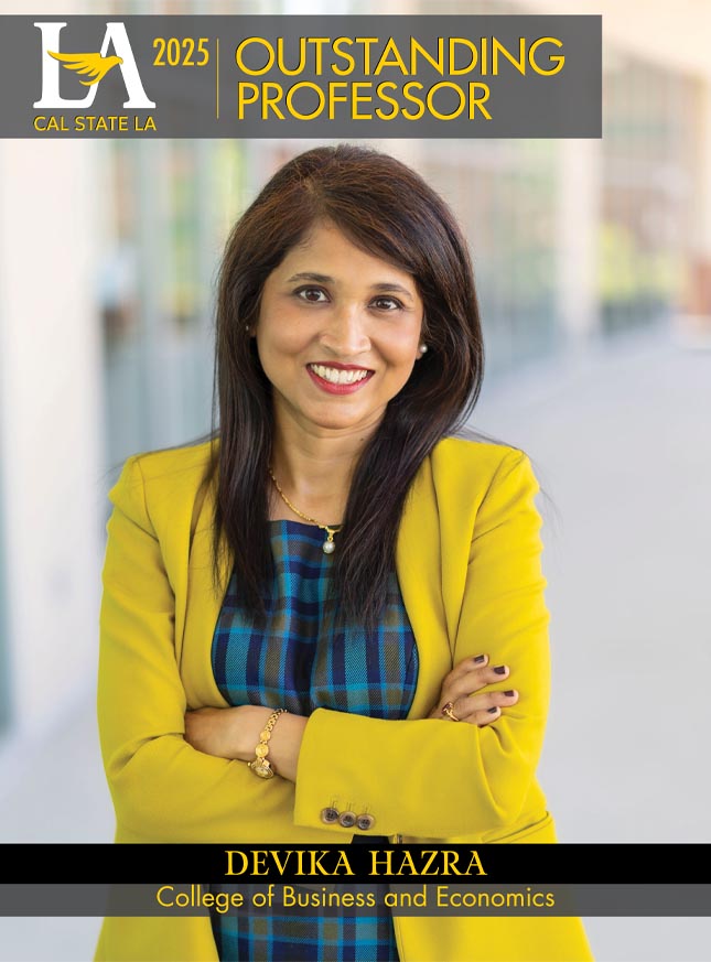 Cal State LA 2025 Outstanding Professor Devika Hazra of the College of Business and Economics poses confidently in a yellow blazer outside a campus building.