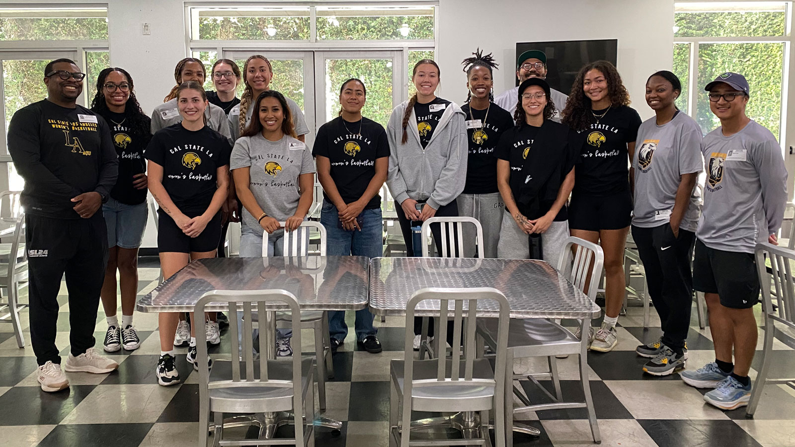 Cal State LA women’s basketball team poses together before volunteering with Habitat for Humanity, supporting community service and outreach efforts.